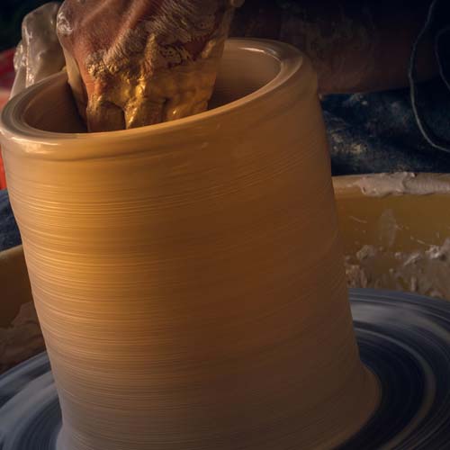 Putting down a porcelain cup plate on ceramic surface 01 Main Image